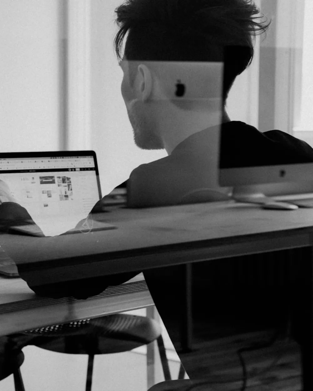 Financial analyst reviewing secure data on a laptop.