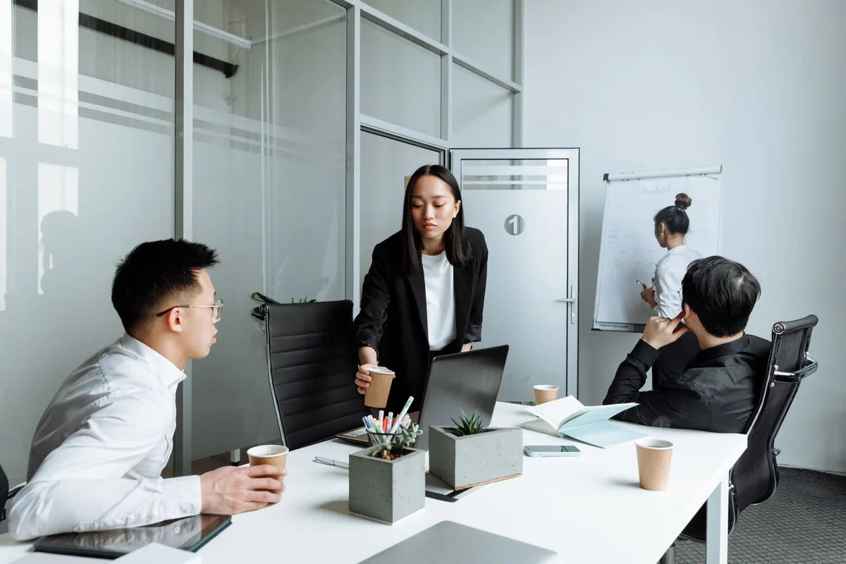 Consultants reviewing a client's business processes together.